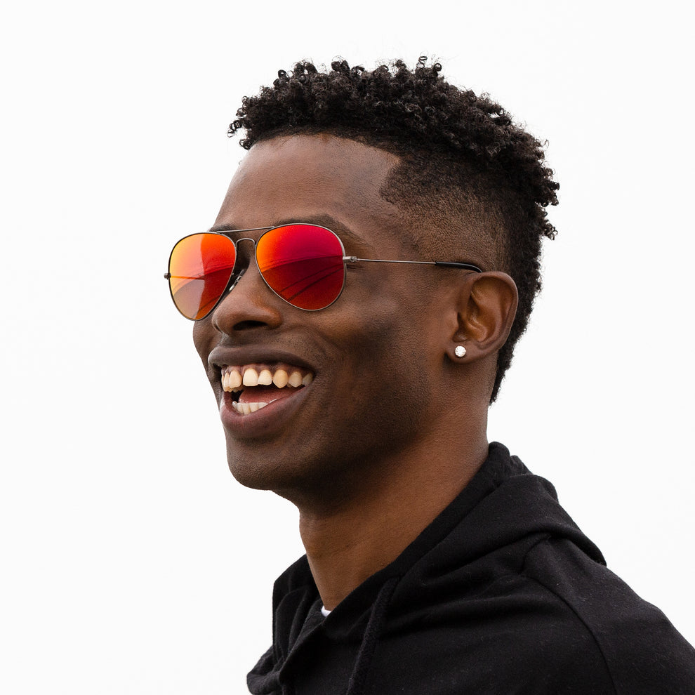 A person wearing sunglasses with Polarized Midnight Sun lenses installed in the frame